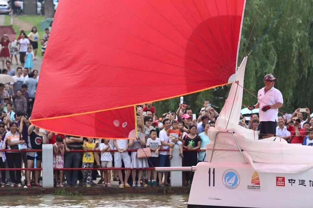 Spectators on the waterfront of Orange Island - XiangJiang Cup International Regatta 2015 © Suzy Rayment